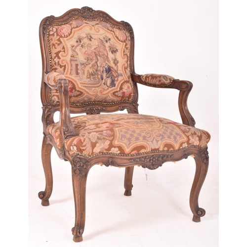 339 - A French continental 19th century oak & petit point fautil upholstered armchair. The chair having a ... 