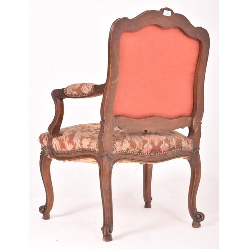 339 - A French continental 19th century oak & petit point fautil upholstered armchair. The chair having a ... 