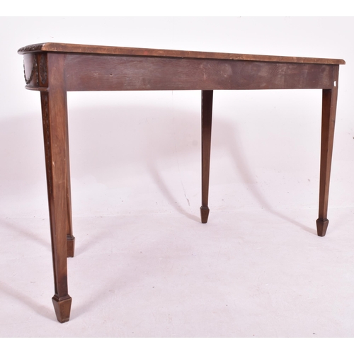 341 - An Adams Revival mahogany demi-lune console hall table. The table having a straight top with carved ... 