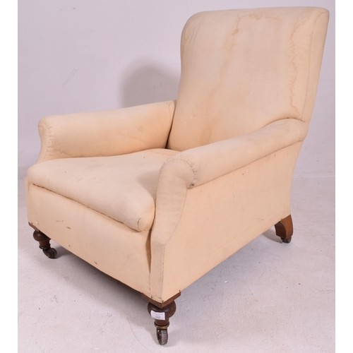 342 - In the manner of Howard & Sons - A Victorian 19th century oak & upholstered armchair. The armchair u... 