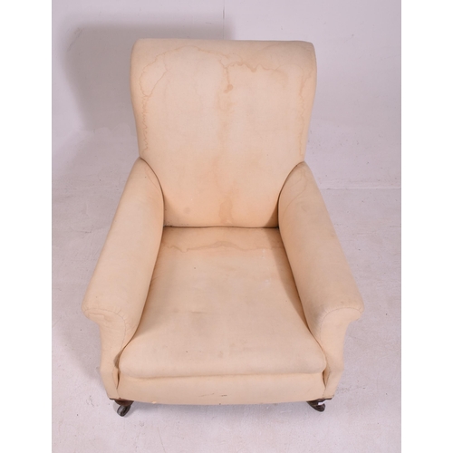 342 - In the manner of Howard & Sons - A Victorian 19th century oak & upholstered armchair. The armchair u... 