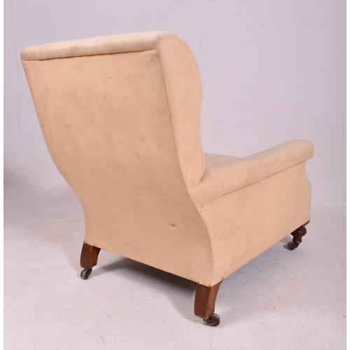 342 - In the manner of Howard & Sons - A Victorian 19th century oak & upholstered armchair. The armchair u... 