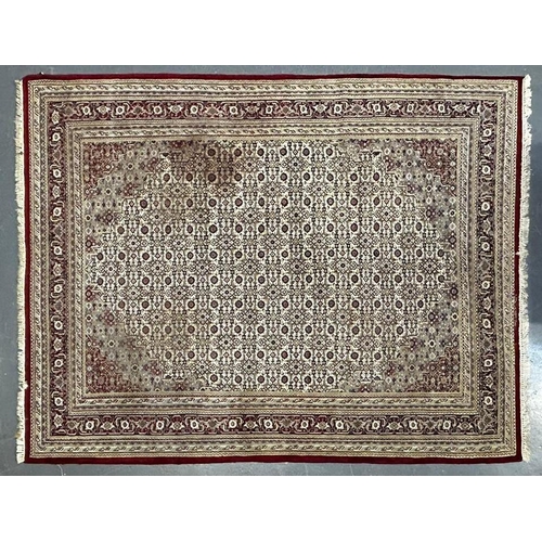 343 - A large 20th century vintage Persian Islamic Moud floor carpet rug. The rug in beige and red colourw... 