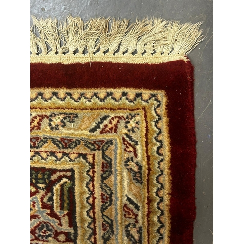 343 - A large 20th century vintage Persian Islamic Moud floor carpet rug. The rug in beige and red colourw... 