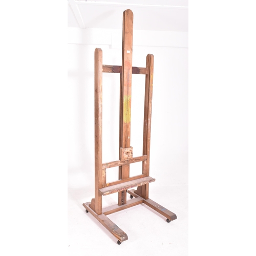 345 - A very large 20th century wooden floor standing artist's easel. Measures approx. 225cm x 74cm x 80cm... 