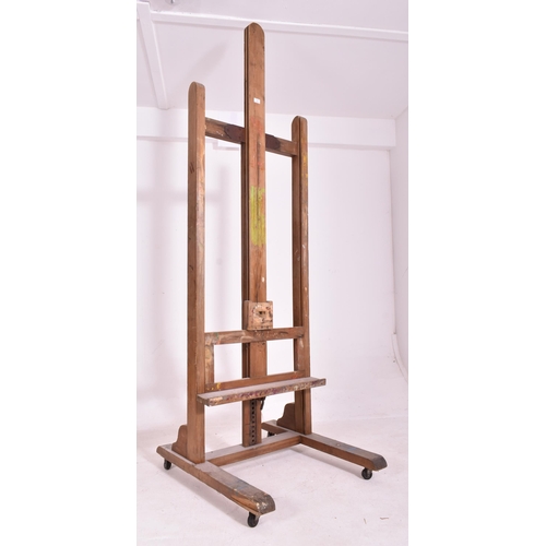 345 - A very large 20th century wooden floor standing artist's easel. Measures approx. 225cm x 74cm x 80cm... 