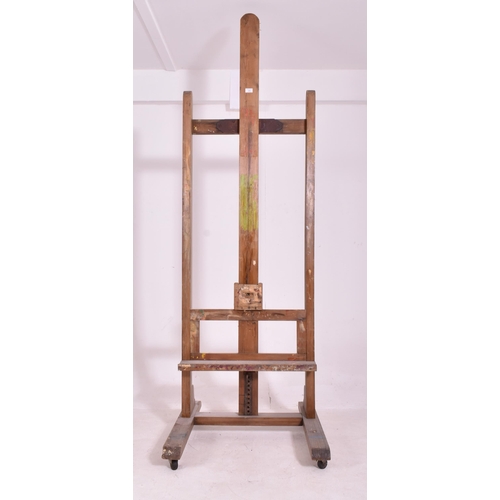 345 - A very large 20th century wooden floor standing artist's easel. Measures approx. 225cm x 74cm x 80cm... 