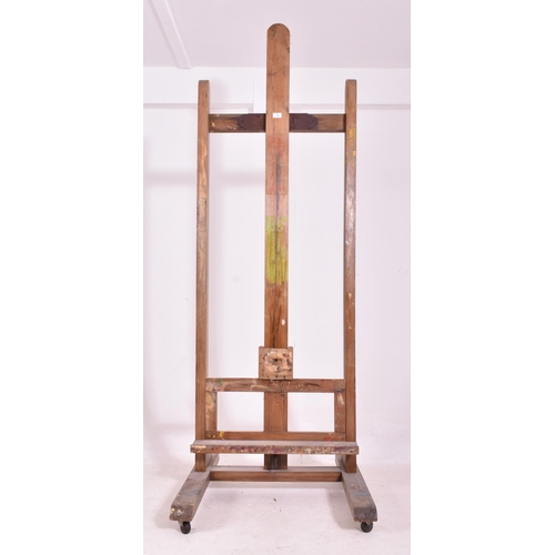 345 - A very large 20th century wooden floor standing artist's easel. Measures approx. 225cm x 74cm x 80cm... 