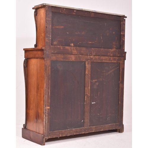 347 - A 19th century rosewood and brass library bookcase. The bookcase having a pierced brass gallery surr... 