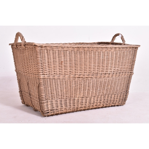 349 - A large believed French continental early 20th century wicker rattan log / laundry basket. The baske... 