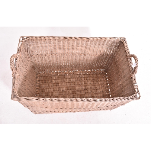 349 - A large believed French continental early 20th century wicker rattan log / laundry basket. The baske... 