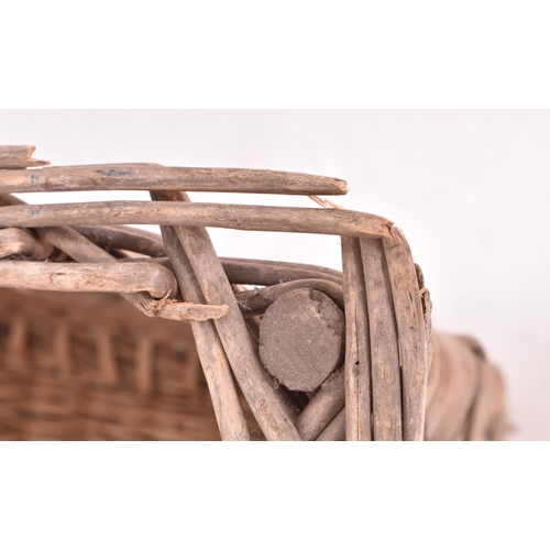 349 - A large believed French continental early 20th century wicker rattan log / laundry basket. The baske... 