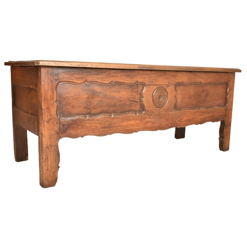 351 - A continental 19th century carved oak window / low coffer. The coffer having a rectangular top over ... 