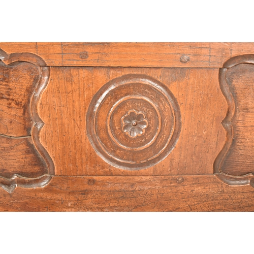 351 - A continental 19th century carved oak window / low coffer. The coffer having a rectangular top over ... 