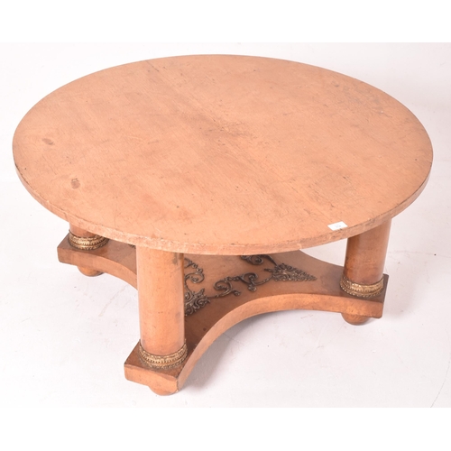 352 - A French Empire inspired ash wood veneered & ormolu round low coffee table. The table having a circu... 