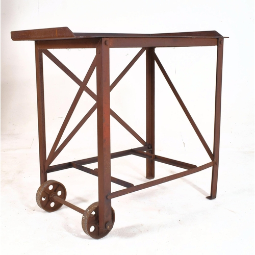 354 - A Victorian late 19th century circa 1890s cast iron printing / welding trolley desk. The desk having... 