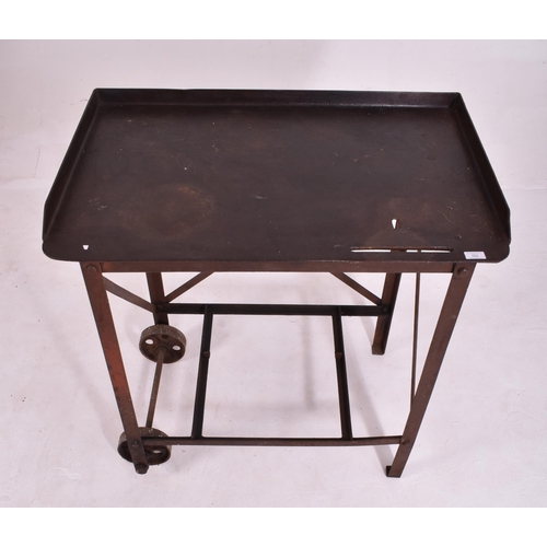 354 - A Victorian late 19th century circa 1890s cast iron printing / welding trolley desk. The desk having... 