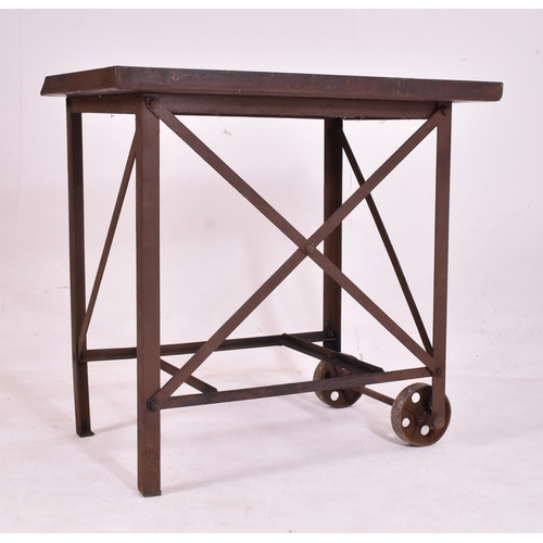 354 - A Victorian late 19th century circa 1890s cast iron printing / welding trolley desk. The desk having... 