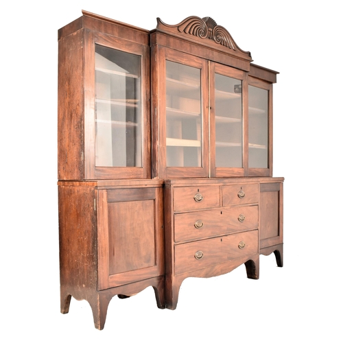 362 - A Channel Islands 19th century mahogany breakfront display bookcase cabinet. The cabinet having a ca... 