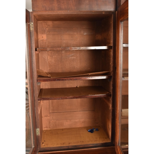 362 - A Channel Islands 19th century mahogany breakfront display bookcase cabinet. The cabinet having a ca... 