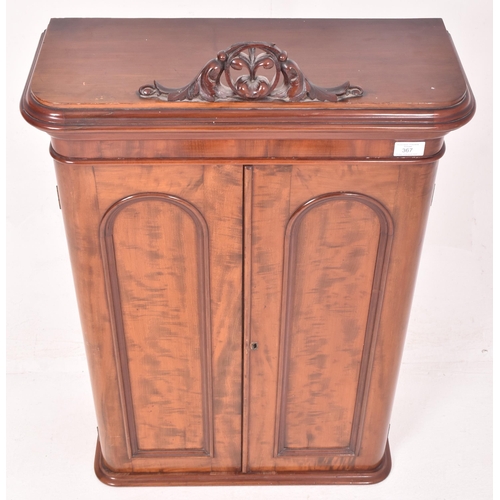 367 - A Victorian inspired walnut wall cupboard cabinet The cabinet having a flared rounded edges pediment... 