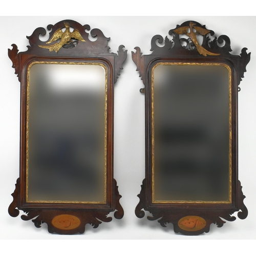 368 - A pair of 19th century mahogany gilded pier mirrors. Each having crested top with phoenix in relief ... 