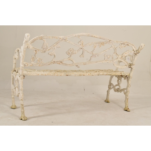 370 - A Victorian 19th century painted cast iron vine three seater garden patio bench. The bench having wh... 