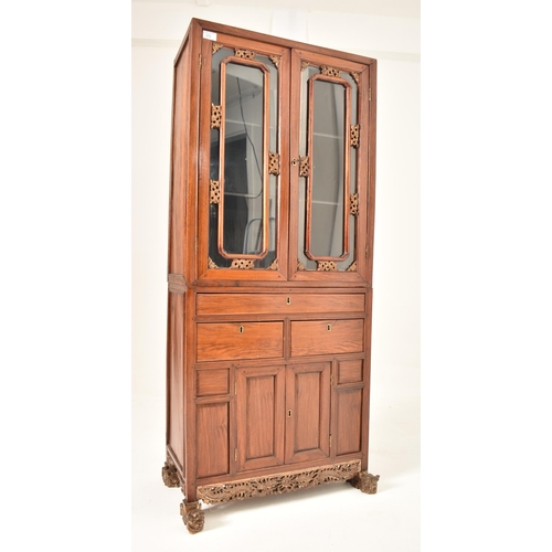 379 - A Chinese Oriental inspired hardwood & gilt painted display cabinet. The cabinet having a astragal g... 