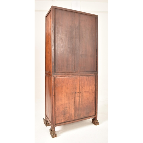 379 - A Chinese Oriental inspired hardwood & gilt painted display cabinet. The cabinet having a astragal g... 