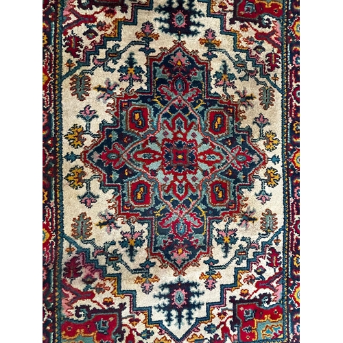 382 - A 20th century Persian Pabla Kashan hand woven wool floor carpet rug. The rug having a central folia... 