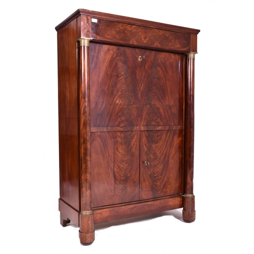 383 - A French Empire 19th century flame mahogany drop down secretaire á abbatant. The secretaire having a... 