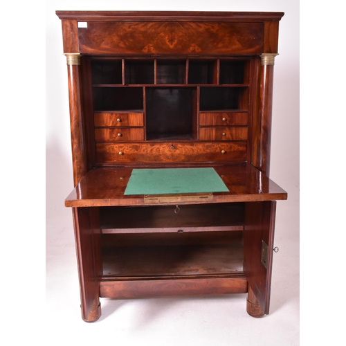 383 - A French Empire 19th century flame mahogany drop down secretaire á abbatant. The secretaire having a... 