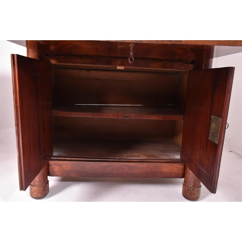 383 - A French Empire 19th century flame mahogany drop down secretaire á abbatant. The secretaire having a... 