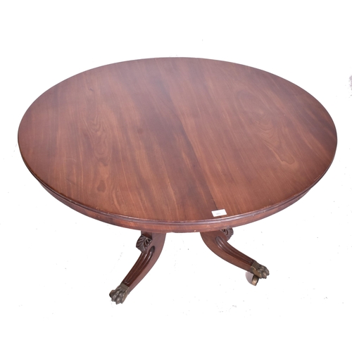 385 - A George III early 19th century mahogany tilt top breakfast table. The table having a circular top w... 