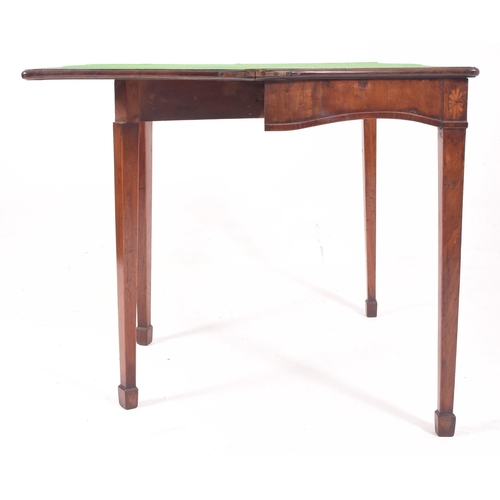 389 - A George III late 18th century mahogany & inlaid serpentine front card table. The table having a fol... 