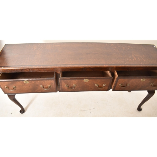 395 - A George III 18th century oak three drawer dresser base sideboard. The base having a straight rectan... 