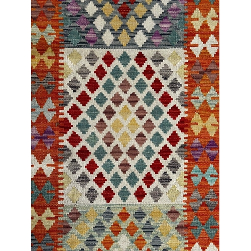 399 - A contemporary Anatolian Turkish Kilim floor carpet runner rug. The runner having a central panel wi... 