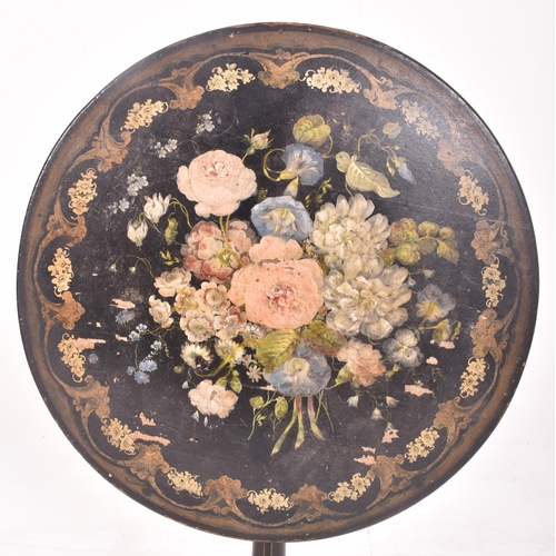 405 - A Napoleon III 19th century ebonised circular tilt top side table. The table having decorative flora... 