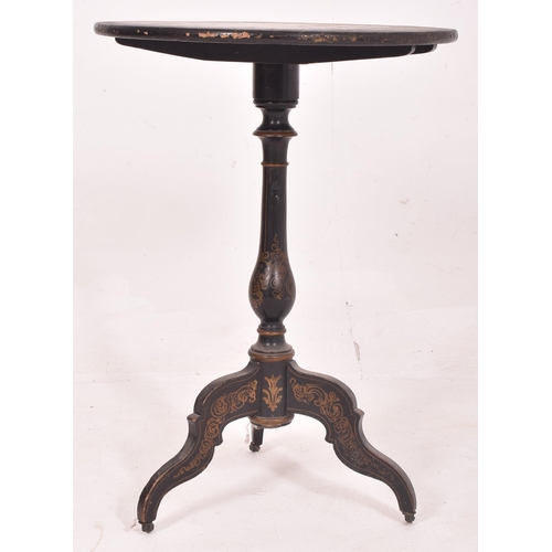 405 - A Napoleon III 19th century ebonised circular tilt top side table. The table having decorative flora... 