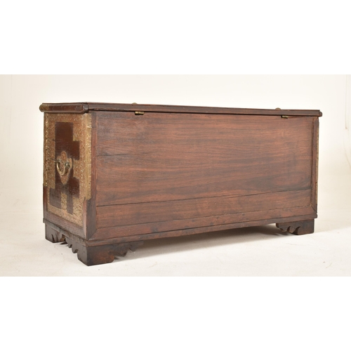 410 - A Zanzibar late 19th century / early 20th century hardwood & brass bound wedding chest. The trunk ha... 