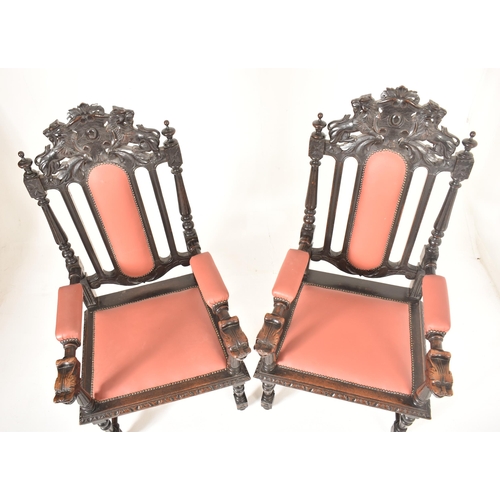 412 - A pair of Carolean Revival 19th century ebonised wood & leather throne chairs. Each having a carved ... 