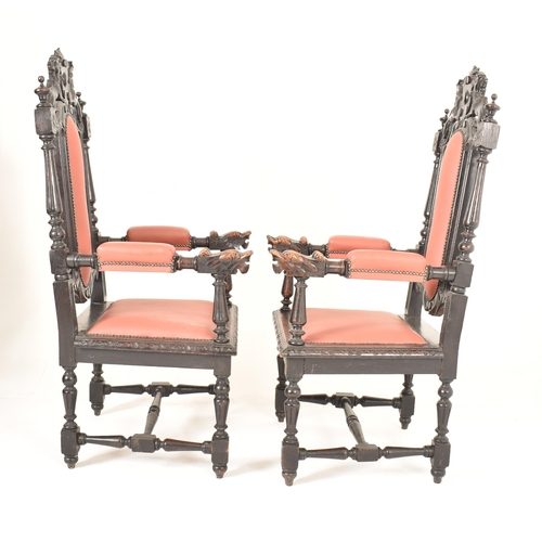 412 - A pair of Carolean Revival 19th century ebonised wood & leather throne chairs. Each having a carved ... 