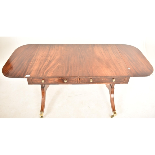 419 - A George III 18th century flame mahogany drop leaf sofa table desk. The table having a rectangular t... 