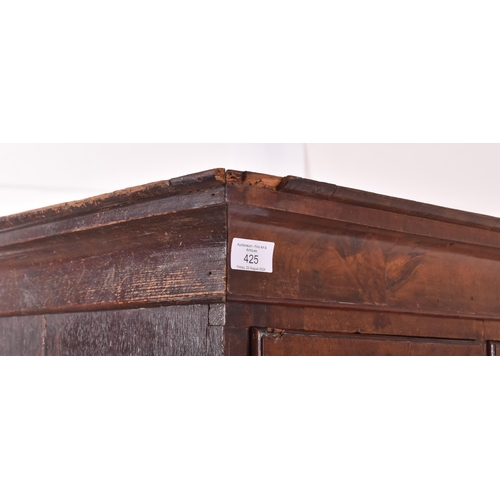 425 - An 18th century Queen Anne walnut tall boy chest on chest. The chest of drawers having a configurati... 