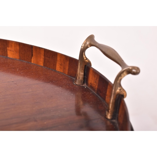 426 - A late Victorian Sheraton Revival mahogany & marquetry inlaid oval butler's tray on stand. The tray ... 