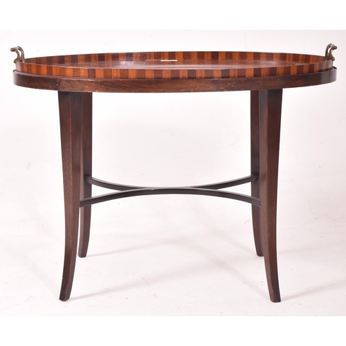 426 - A late Victorian Sheraton Revival mahogany & marquetry inlaid oval butler's tray on stand. The tray ... 