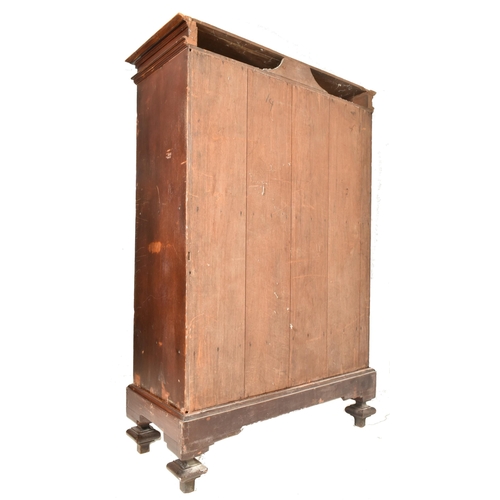 427 - A Anglo-Colonial 19th century campaign teak armoire wardrobe. The wardrobe a flared pediment atop ov... 