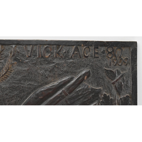 430 - An early 20th century 1909 carved oak pub sign / carved panel. The sign carved in relief by J. Vick ... 