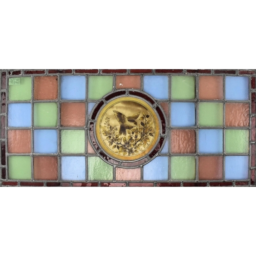 434 - A Victorian 19th century leaded stained glass decorative window panel. The rectangular panel having ... 