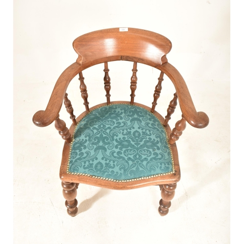 438 - A Victorian 19th century mahogany captain's smokers bow armchair. The chair having a shaped back sup... 